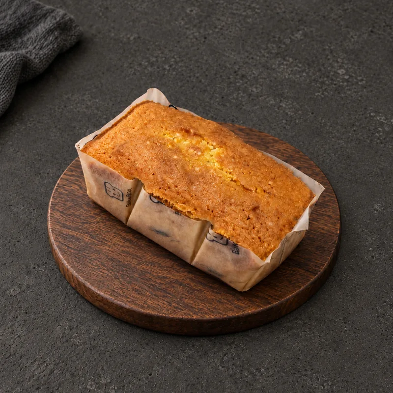 Tea Cake with a golden textured top in BakeBox paper